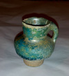 A Miniature Ceramic  Green Glazed Jar,