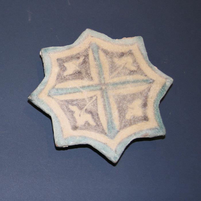  A Syrian Glazed Pottery Star Tile